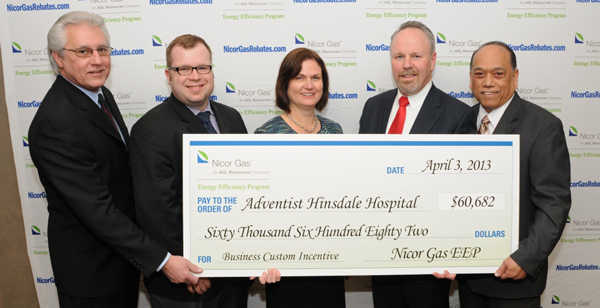 Photo of Adventis Hinsdale Hospital employees receiving their energy savings rebate check because of ACSI